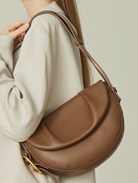 « Autumn Elegance: Styling with the Semi-Moon Genuine Leather Saddle Bag in Brown, Black, and White »