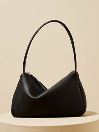 « Discover the Elegance of Emilia: The Medium-Sized Togo Leather Baguette Shoulder Bag for Women in Classic Monochrome Shades »